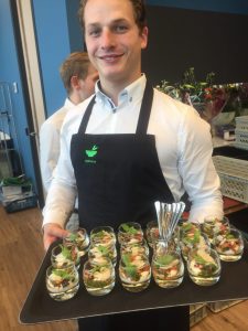 waiter with tray of appetizers for business catering