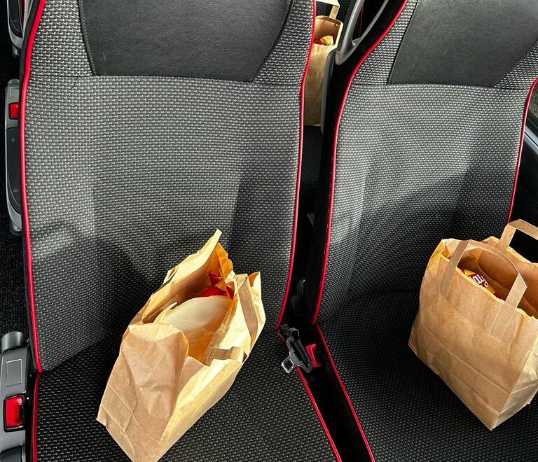 Lunch bags placed on the seats of a luxery bus coach in Amsterdam