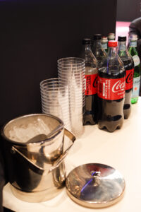 View of a bar with ice bucket, sodas and waters