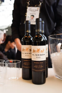Close up three bottles of El Meson Rioja red wine on a bar