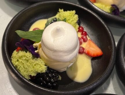 Harry's dessert creation with meringue and red fruits and cream of tonka beans